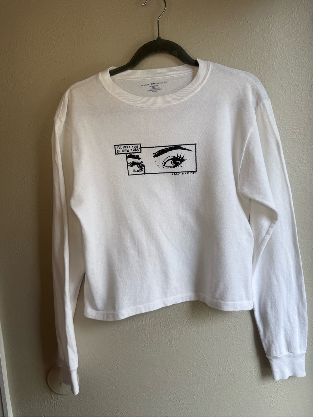 Brandy Melville White Crewneck Sweater with Black Eye Graphic